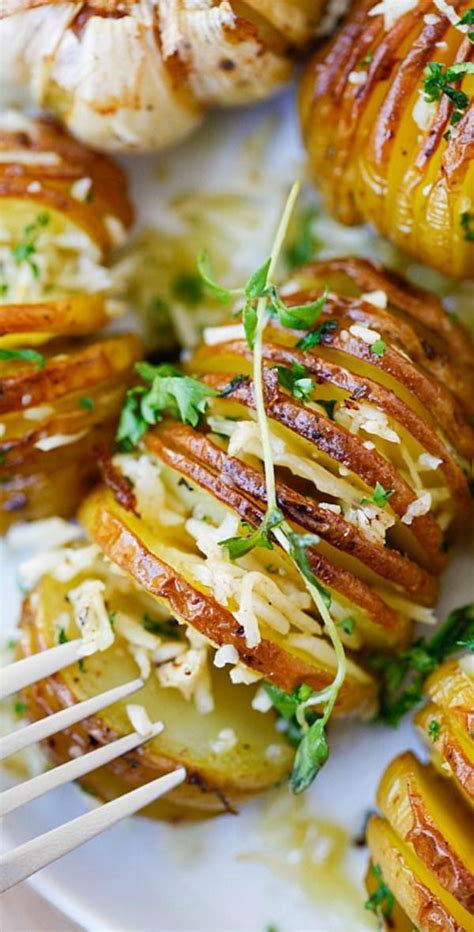 Grilled Potatoes With Parmesan Cheese And Herbs On A White Plate Ready