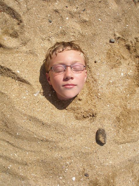 Head In The Sand Boys Head Enjoying The Sunshine On The Be Flickr