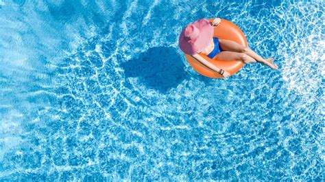 Premium Photo Beautiful Woman In Hat In Swimming Pool Aerial Top View