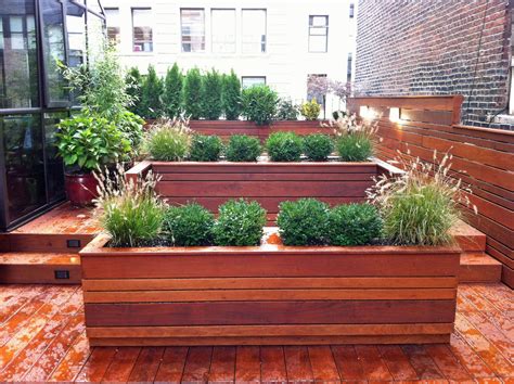 The side ends of the planter boxes are made out of treated 2 x 6 wood and are going to be cut at 15 degrees off square. This NYC custom roof garden design features contemporary ...