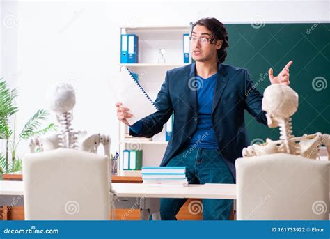 Male Teacher And Skeleton Student In The Classroom Stock Photo Image