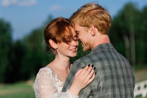 Nice Redhead Young Just Married Happy Couple Kissing In The Sunset