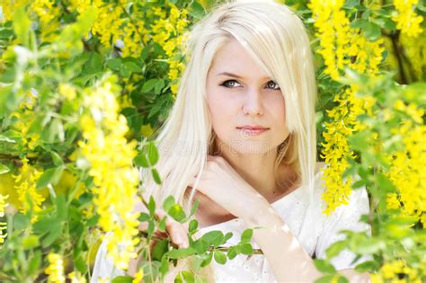 Beautiful Blonde Girl With Yellow Flowers Stock Image Image Of Adult