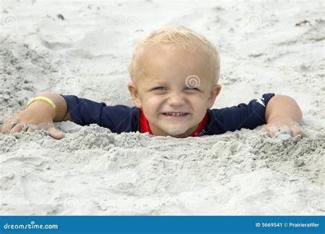 Little Boy Buried In Sand Up To Head Stock Image Image Of Happy Sand