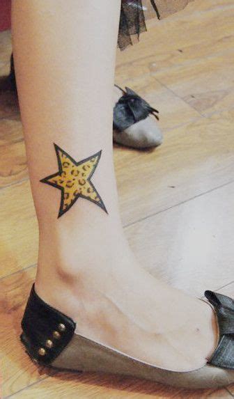 Bright Yellow Star Tattoo On The Leg Star Tattoo Girly Tattoos