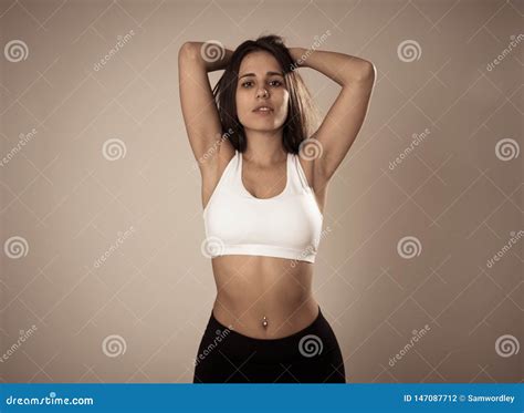 Portrait Of Sporty Beautiful Brunette Woman In Sport Clothes Looking Sensual And Fit Arkivfoto