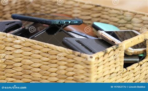 Close Up Of A Box Or Basket Of Collected Mobile Cell Phones Collected