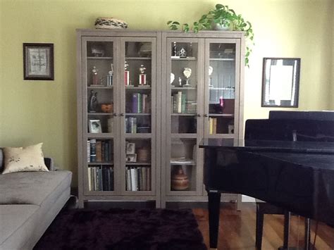 Amber from amber interiors diy'd this floating storage using two cabinets from ikea's sektion line (originally intended to be a cabinet above a fridge). Book storage idea | Glass cabinet doors, Home, Ikea hemnes ...