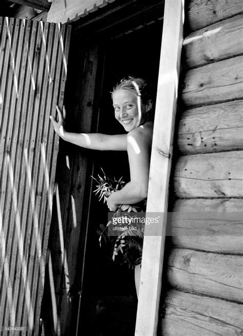 Smiling Woman Going Into A Finnish Sauna Undated Photographer