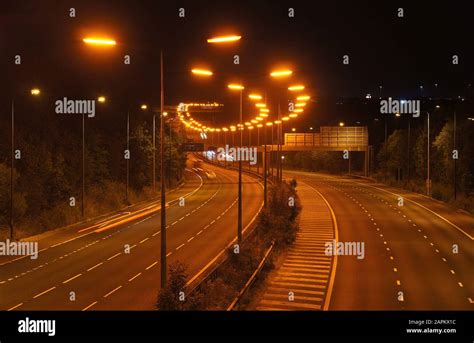 Low Pressure Sodium Street Lights On An English Motorway Repetition