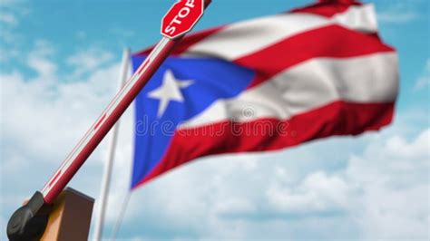Opening Boom Barrier With Stop Sign Against The Puerto Rican Flag Free