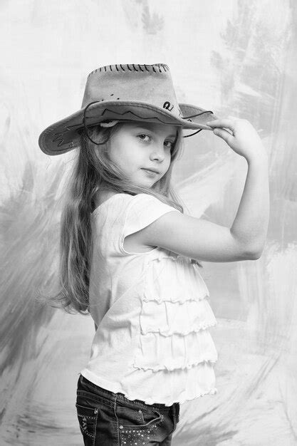Premium Photo Little Girl In Cowboy Or Cowgirl Outfit With Hat