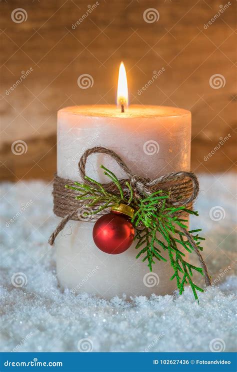 Burning Candle With Christmas Ornaments On Snow Stock Photo Image Of