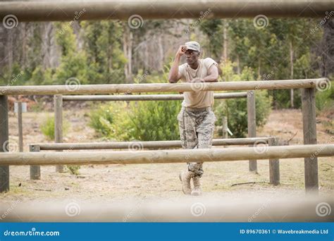 Military Man Standing During Obstacle Course In Boot Camp Stock Image
