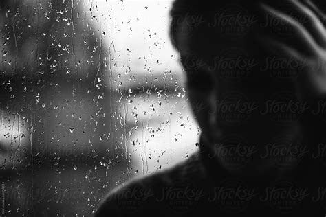 Sad Woman At Window During A Rainy Day Stocksy United
