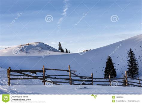 Winter Rural Background With Small Wooden Alpine House Pines Fence
