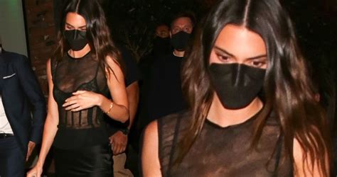 kendall jenner oozes sex appeal in a mesh lbd with a clingy silk skirt as she grabs dinner in