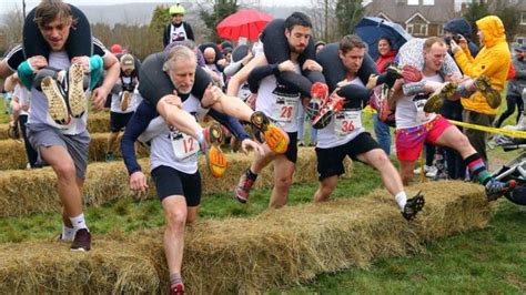 Wife Carrying Race Winners In Proposal Joy On Finish Line Bbc News