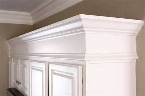 Light rail molding is used to finish the bottom of wall cabinets. The Yellow Cape Cod: Making Cabinets Taller {Builder ...