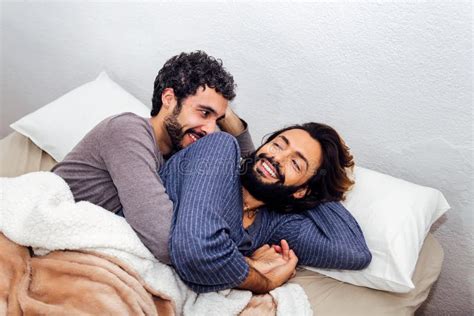 Male Couple Cuddling In Bed Happy In The Morning Stock Image Image Of