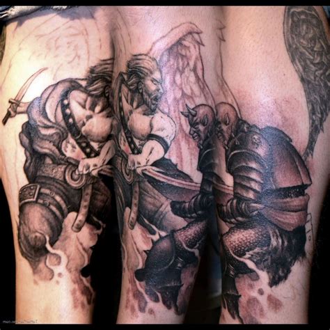 Angel And Demon Fighting Tattoo