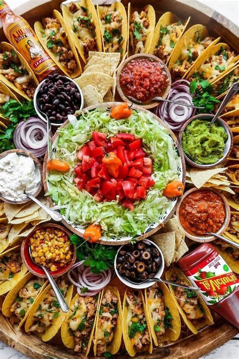 ground beef taco recipe glass bowls filled   ingredients mini tacos arranged