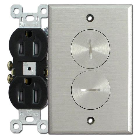 An Electrical Outlet With Two Black And White Outlets On Each Side One