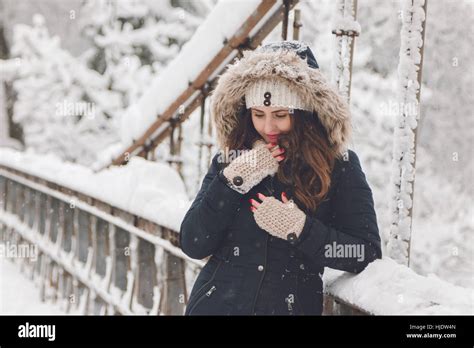 Winter Portrait Of A Beautiful Woman In The Snowfall Stock Photo Alamy