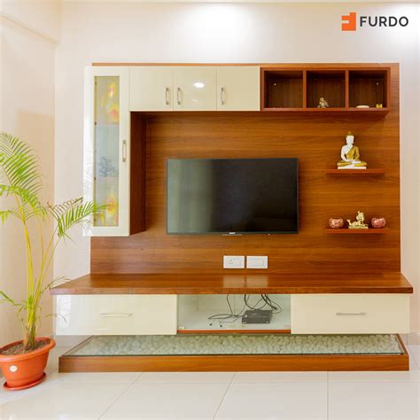 These floating shelves lend a sleek and elegant look. TV Unit Design | Modern tv unit designs, Tv unit furniture ...