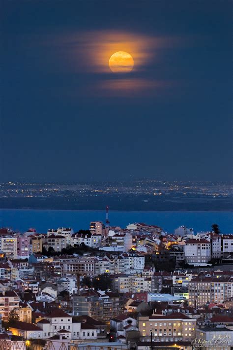 The “blue Moon” Rising Above The City Of Lisbon Astrophotography By