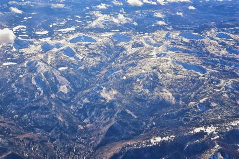 Aerial View Of Topographical Rocky Mountain Landscapes On Flight Over