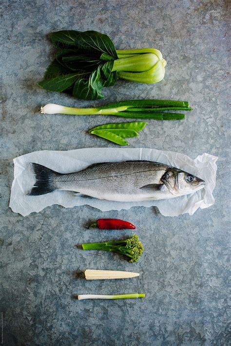 Line Caught Sea Bass And Ingredients For Cooking It With By Darren Muir For Stocksy United
