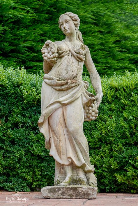 Composition garden statue lady holding fruit