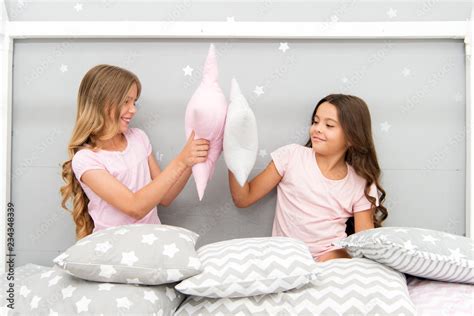 sisters play pillows bedroom party pillow fight pajama party evening time for fun sleepover