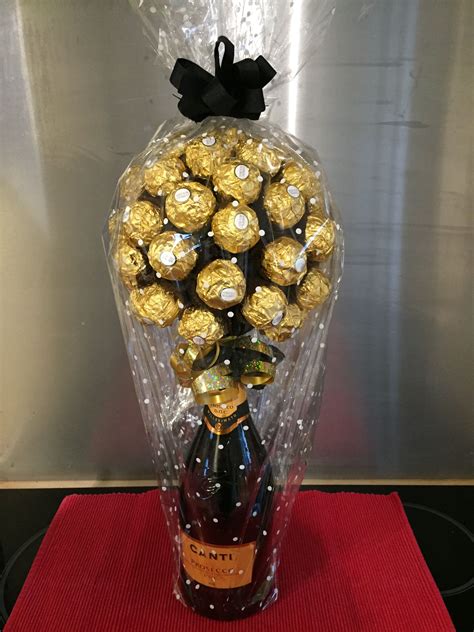 Chocolate crafts chocolate pack chocolate flowers bouquet edible bouquets sweet trees gift wraping magazine crafts edible crafts candy creative gifts for grads, gifts grads love, creative ways to give money, teen gifts, best graduation gift ideas, fun and easy diy graduation grad gifts. Ferrero Rocher Champagne bottle | Valentines candy bouquet ...