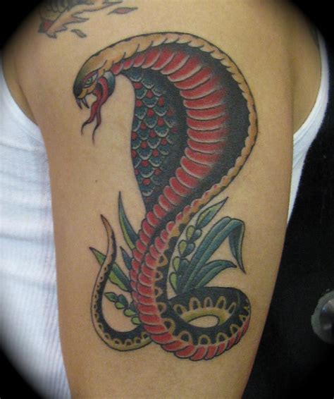 Twisted rings cobra with the opened hood on a dark background. Cobra Tattoos Designs, Ideas and Meaning | Tattoos For You