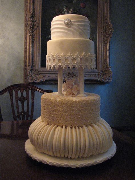 4 Tier Victorian Influence Wedding Cake In Ivory With Ruching And Lace Accents
