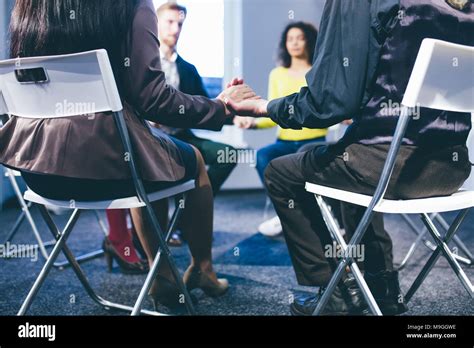 Large Group Of People Having A Counseling Session Stock Photo Alamy