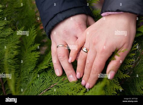 Husband And Wife Wedding Rings On Hands Stock Photo Alamy