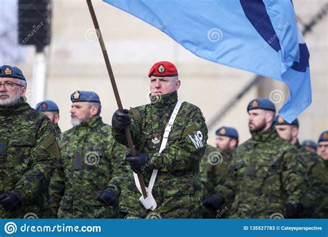 Details With The Uniform And Flag Of Canadian Military Police Editorial