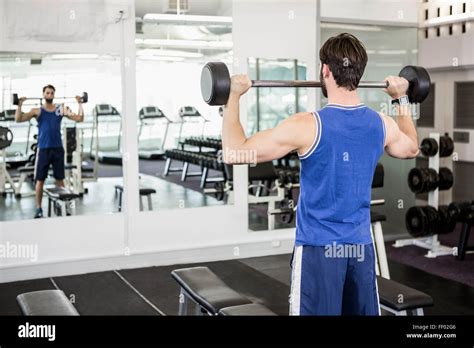 Muscular Man Lifting Barbell Stock Photo Alamy