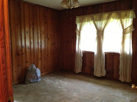 When using techniques that allow the current wood paneling stain to be visible, coordinate your paint color with the existing stain. How to decorate around dark wood paneling?