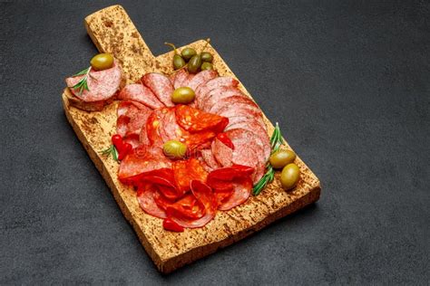 Cold Meat Plate With Salami And Chorizo Sausage On Cork Wood Board