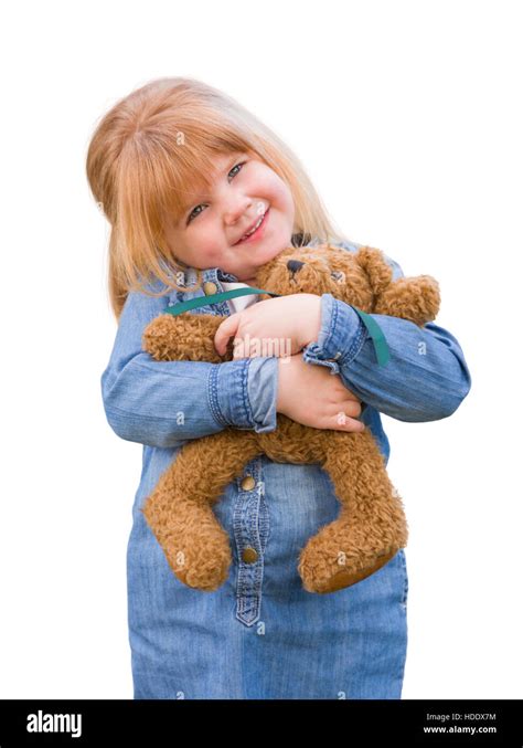 Cute Little Girl Holding Her Teddy Bear Isolated On A White Background