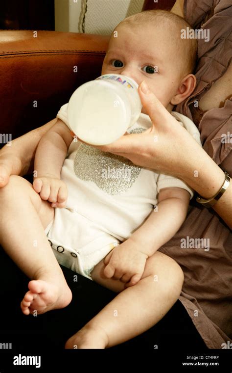 Infant Drinking From Baby Bottle Stock Photo Alamy