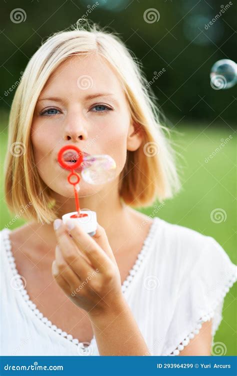 Woman Portrait And Blowing Bubbles In Nature For Fun Day Or Playing At Outdoor Park Face Of