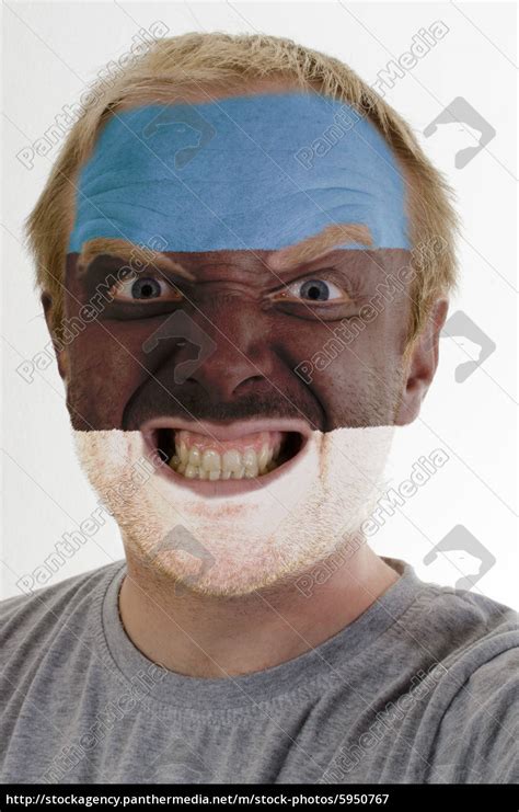 Face Of Crazy Angry Man Painted In Colors Of Estonia Royalty Free