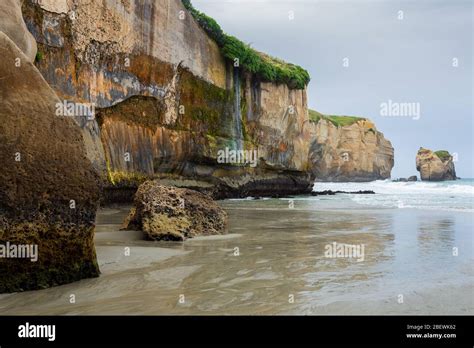 Tunnel Beach Surrounded By Into The Sandstone Cliffs Near Dunedin New