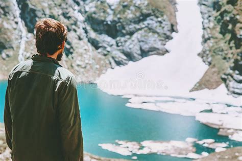 Man Enjoying Icy Lake In Mountains Landscape Stock Image Image Of