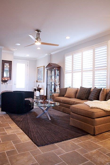 This condo's main living areas are one long rectangle with tall ceilings. another sofa in front of a windwo (With images) | Narrow living room, Small spaces, Long narrow ...